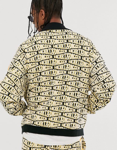 Heart & Dagger repeat logo print zip up jacket-Yellow