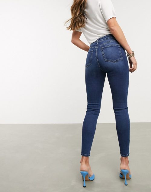 ASOS DESIGN Ridley high waisted skinny jeans in dark stonewash blue with busted knees