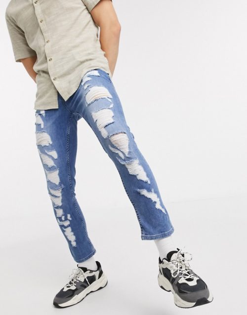 ASOS DESIGN cropped super skinny jeans in light wash blue with extreme heavy rips