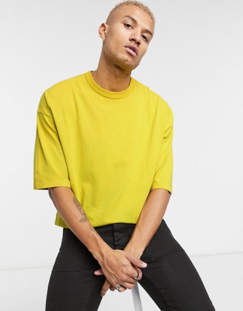 ASOS DESIGN oversized t-shirt with half sleeve in acid wash in yellow